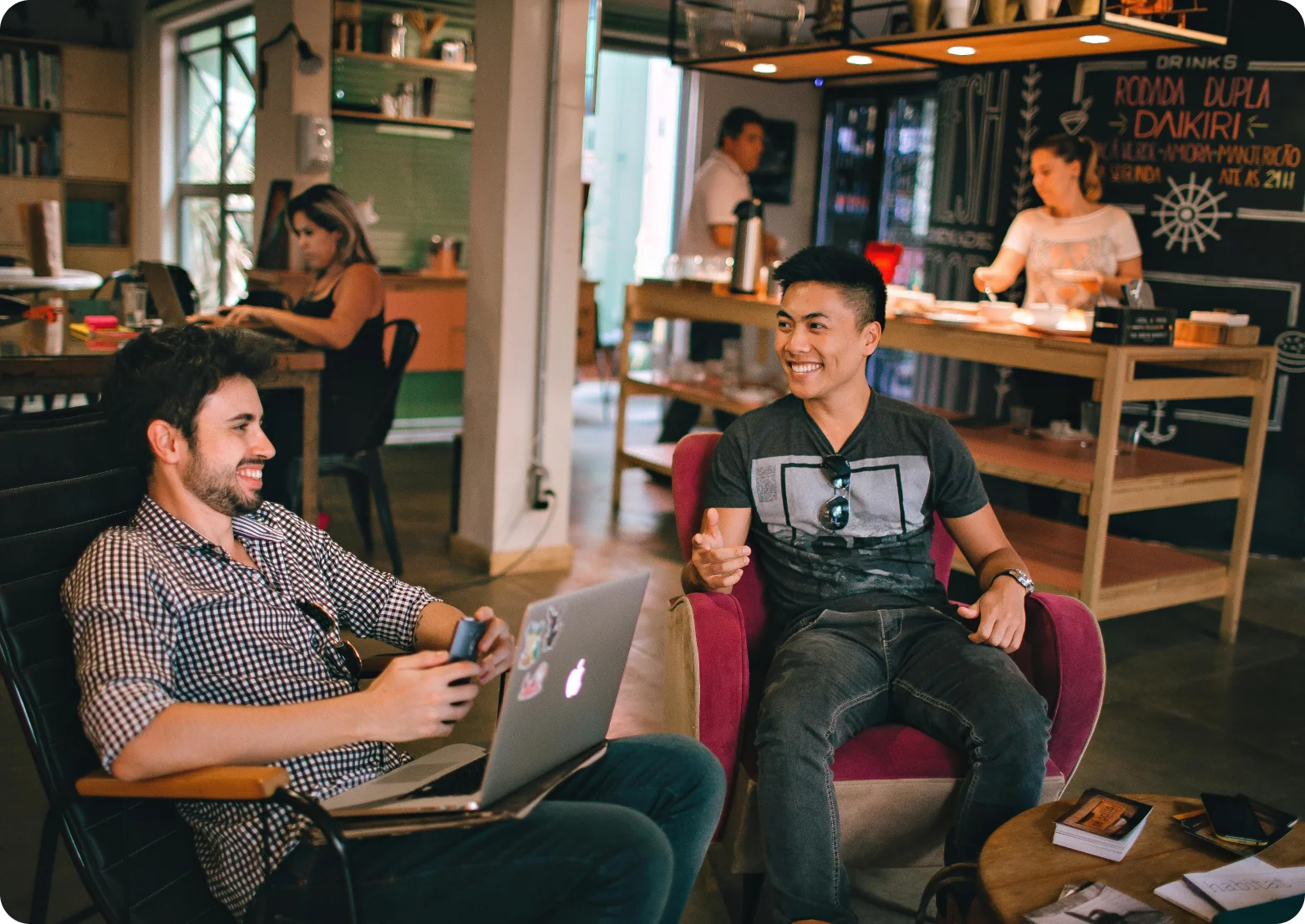 Two developers talking in a café
